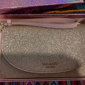 Brand New Kate Spade Wristlet. Glittery Gold rose.